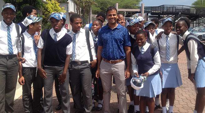 Dr Shaun Ruggunan with high school pupils.